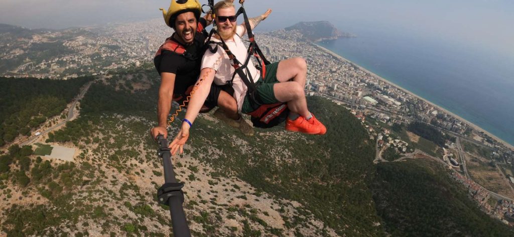 Two guys paragliding